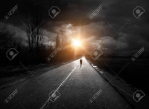 A dark highway stretching into a sunset—symbolizing the emotional journey through grief, loss, and healing with therapy in Phoenix, Arizona.